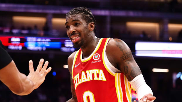 Jan 5, 2022; Sacramento, California, USA; Atlanta Hawks guard Delon Wright (0) questions the referee after a play against the Sacramento Kings during the fourth quarter at Golden 1 Center.